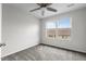 Bright bedroom features a ceiling fan, neutral walls and plush gray carpet at 1102 Latitude Dr, Durham, NC 27713