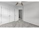 Bedroom with gray carpet and a large closet. There is a bathroom entrance at 1102 Latitude Dr, Durham, NC 27713