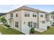 Two-story townhouse featuring a patio, lawn, and white privacy fence at 1102 Latitude Dr, Durham, NC 27713