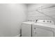 Laundry room featuring a washer, dryer, and overhead storage shelf at 1102 Latitude Dr, Durham, NC 27713