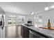 Stylish living area with a granite countertop, stainless steel appliances, and an open layout at 1102 Latitude Dr, Durham, NC 27713