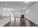Bright living room featuring wood floors, modern fireplace, and large windows for ample sunlight at 1102 Latitude Dr, Durham, NC 27713