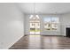 Inviting living room with sliding door, fireplace, and ample natural light at 1102 Latitude Dr, Durham, NC 27713