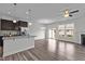 Open-concept living area with hardwood floors, abundant natural light, and a view of the backyard at 1102 Latitude Dr, Durham, NC 27713