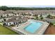 An aerial view of a community pool area with lounge chairs, tables, and surrounding neighborhood at 1102 Latitude Dr, Durham, NC 27713
