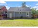 Spacious backyard with well-kept lawn and partial view of the house at 111 Mcdole Cir, Cary, NC 27511