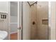 Bathroom showing tiled walk-in shower with built-in shelf and glass door at 111 Mcdole Cir, Cary, NC 27511