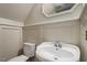Bathroom features a toilet, sink, mirror, and painted paneling at 111 Mcdole Cir, Cary, NC 27511