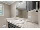 Classic bathroom with granite countertops, a white sink, and gray cabinets at 111 Mcdole Cir, Cary, NC 27511