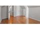 Angled attic bedroom with hardwood flooring, and a double door closet at 111 Mcdole Cir, Cary, NC 27511