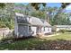View of well-maintained home with a large yard and mature trees at 111 Mcdole Cir, Cary, NC 27511