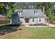 Charming home with a red front door and a well-maintained lawn and landscaping at 111 Mcdole Cir, Cary, NC 27511