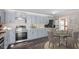 Eat-in kitchen features updated appliances, stylish countertops, and modern cabinetry at 111 Mcdole Cir, Cary, NC 27511