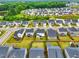An aerial view of a neighborhood featuring homes with fenced yards and mature trees at 1112 Prewitt Ranch Dr, Holly Springs, NC 27540