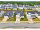 An aerial view of modern homes featuring well-manicured lawns and inviting curb appeal at 1112 Prewitt Ranch Dr, Holly Springs, NC 27540