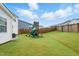 Spacious backyard with a fun playground for  at 1112 Prewitt Ranch Dr, Holly Springs, NC 27540