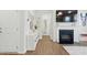 Stylish living room with a fireplace, and stylish decor, blending comfort and elegance for modern living at 1112 Prewitt Ranch Dr, Holly Springs, NC 27540