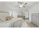 Spacious main bedroom featuring soft neutral tones, elegant furnishings, and ample natural light at 1112 Prewitt Ranch Dr, Holly Springs, NC 27540