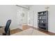 Bright office featuring French doors, a wooden bookcase, and a cozy rug for a productive workspace at 1112 Prewitt Ranch Dr, Holly Springs, NC 27540