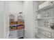 Walk-in pantry with custom shelving, providing ample storage space at 1112 Prewitt Ranch Dr, Holly Springs, NC 27540
