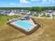 Aerial view of a community pool with lounge chairs, perfect for summer days at 1112 Prewitt Ranch Dr, Holly Springs, NC 27540