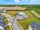 Aerial view of community pool with surrounding green space, parking, and residential area at 1112 Prewitt Ranch Dr, Holly Springs, NC 27540