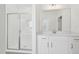 Modern bathroom features a glass-enclosed shower and bright white vanity with a quartz countertop at 112 Moonflower Ln # Homesite 267, Wilson's Mills, NC 27520