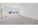 Bright bedroom with plush carpet and freshly painted white walls, offering ample space at 112 Moonflower Ln # Homesite 267, Wilson's Mills, NC 27520