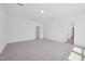Bedroom with plush carpet and freshly painted white walls, offering ample space and closet space at 112 Moonflower Ln # Homesite 267, Wilson's Mills, NC 27520