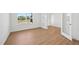 Bright bedroom with hardwood floors, white walls, natural light, and French doors to another room at 112 Moonflower Ln # Homesite 267, Wilson's Mills, NC 27520