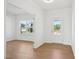 Bright entryway with hardwood floors, white walls, and natural light filtering through the windows at 112 Moonflower Ln # Homesite 267, Wilson's Mills, NC 27520