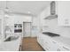 Bright kitchen with white cabinetry, stainless appliances, gas cooktop, and quartz countertops at 112 Moonflower Ln # Homesite 267, Wilson's Mills, NC 27520