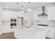 Beautiful kitchen with an island, stainless steel appliances, and modern lighting fixtures at 112 Moonflower Ln # Homesite 267, Wilson's Mills, NC 27520