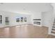 Bright, airy living room with door to yard and fireplace at 112 Moonflower Ln # Homesite 267, Wilson's Mills, NC 27520