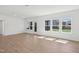 Open living room with backyard access and windows at 112 Moonflower Ln # Homesite 267, Wilson's Mills, NC 27520