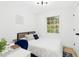 Cozy bedroom with natural light, modern decor, and a writing desk at 117 Bertie Dr, Raleigh, NC 27610