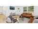 Inviting living room with modern decor, warm lighting, and hardwood floors at 117 Bertie Dr, Raleigh, NC 27610
