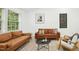 Cozy living room showcasing modern decor, a patterned rug, and two comfortable sofas at 117 Bertie Dr, Raleigh, NC 27610