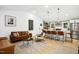 Open concept living room featuring a kitchen island, neutral decor, and modern furnishings at 117 Bertie Dr, Raleigh, NC 27610