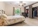 Cozy bedroom with soft lighting, ceiling fan, and closet with sliding doors at 119 Danforth Dr, Cary, NC 27511