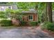 Exterior brick house with red shutters surrounded by green plants at 119 Danforth Dr, Cary, NC 27511