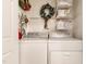 Laundry room with washer, dryer, and decorations at 119 Danforth Dr, Cary, NC 27511