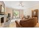 Comfortable living room with natural light, fireplace, and plush armchairs at 119 Danforth Dr, Cary, NC 27511