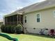 Spacious backyard with a screened porch offering a relaxing outdoor living space, and playful elements at 119 Hunterwood Pl, Benson, NC 27504
