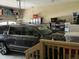 Spacious garage featuring a dark SUV, ample storage solutions, and a well-organized space at 119 Hunterwood Pl, Benson, NC 27504