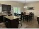 Eat-in kitchen with center island and granite countertops seamlessly connects to a breakfast dining area at 119 Hunterwood Pl, Benson, NC 27504