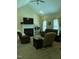 Bright living room with fireplace, high ceilings, and large windows, perfect for entertaining at 119 Hunterwood Pl, Benson, NC 27504