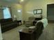 Inviting living room with neutral tones, comfortable seating, and ample natural light at 119 Hunterwood Pl, Benson, NC 27504
