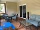 Relaxing screened-in porch featuring dining and lounging areas, perfect for outdoor enjoyment at 119 Hunterwood Pl, Benson, NC 27504