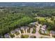 An aerial view of the community, displaying lush greenery and a tranquil pond at 1237 Shirehall Park Ln, Wake Forest, NC 27587